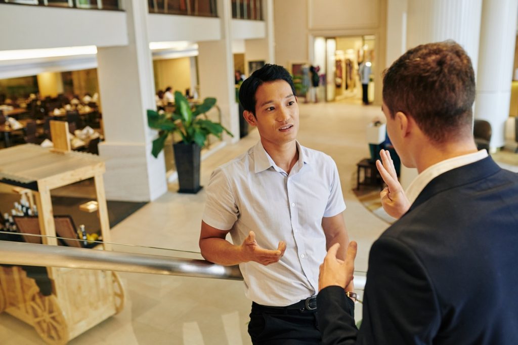 two man discussing good feedback from client