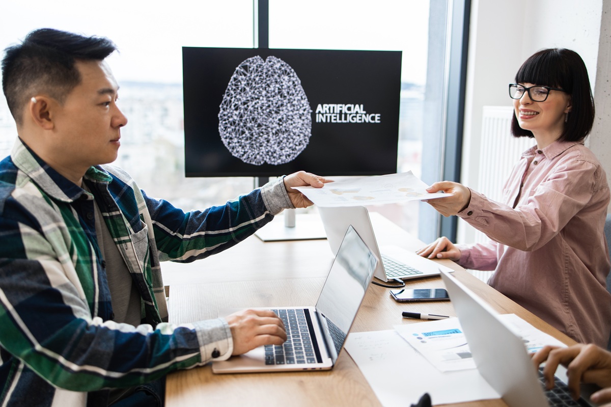 coworkers discussing ai tools for work process