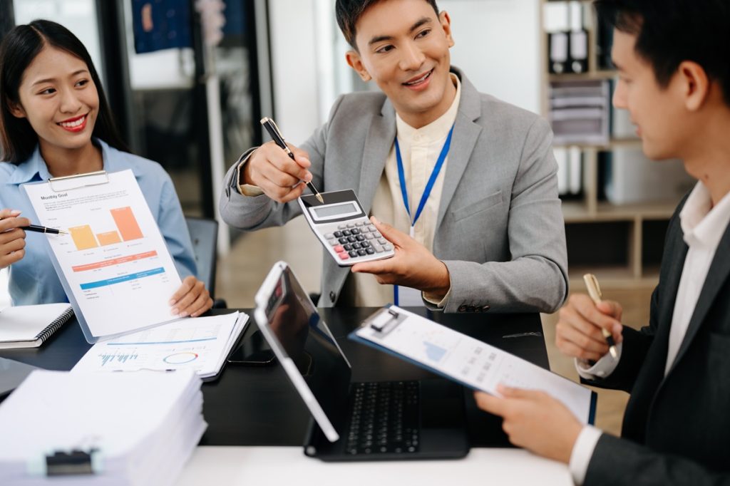 three professional accountant reviewing company financial statement