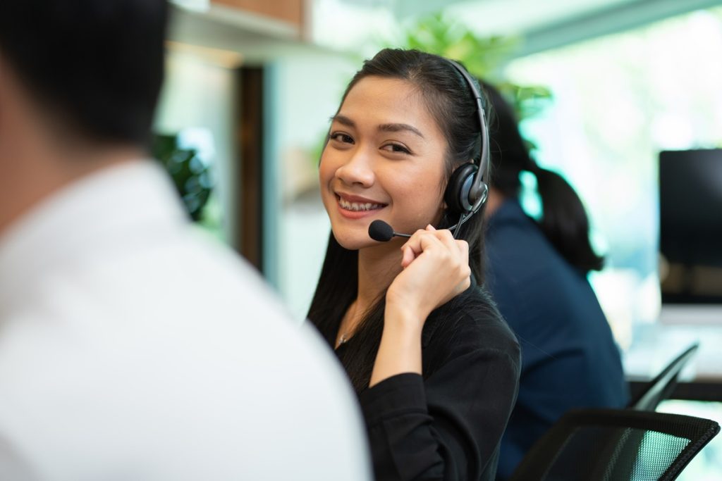 female telemarketing taking calls happy with customer service jobs