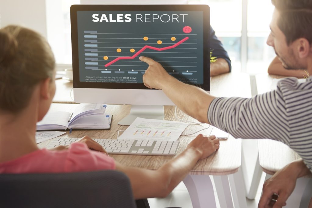 b2b sales outsourcing team discuss sales report