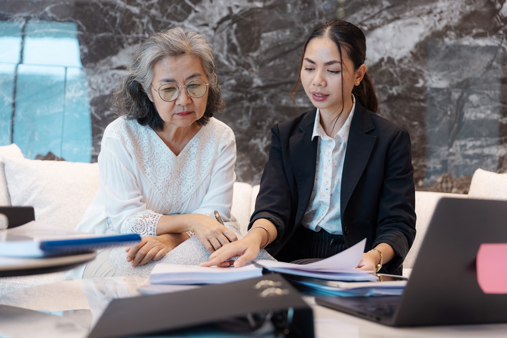 Two professionals collaborate for an accounting software review
