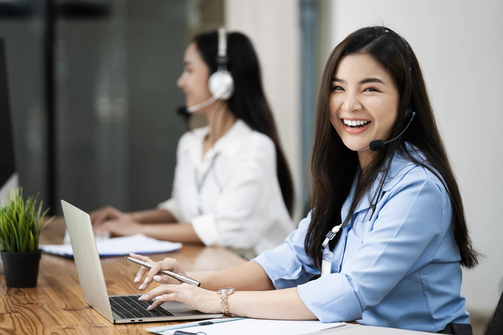 A cheerful BPO agent contributing to customer service experience improvement.