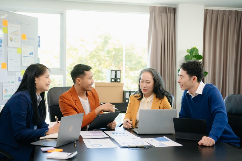 four team member discussing strategy